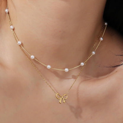 Pearl Double Layer Choker — Gold Bow Pendant